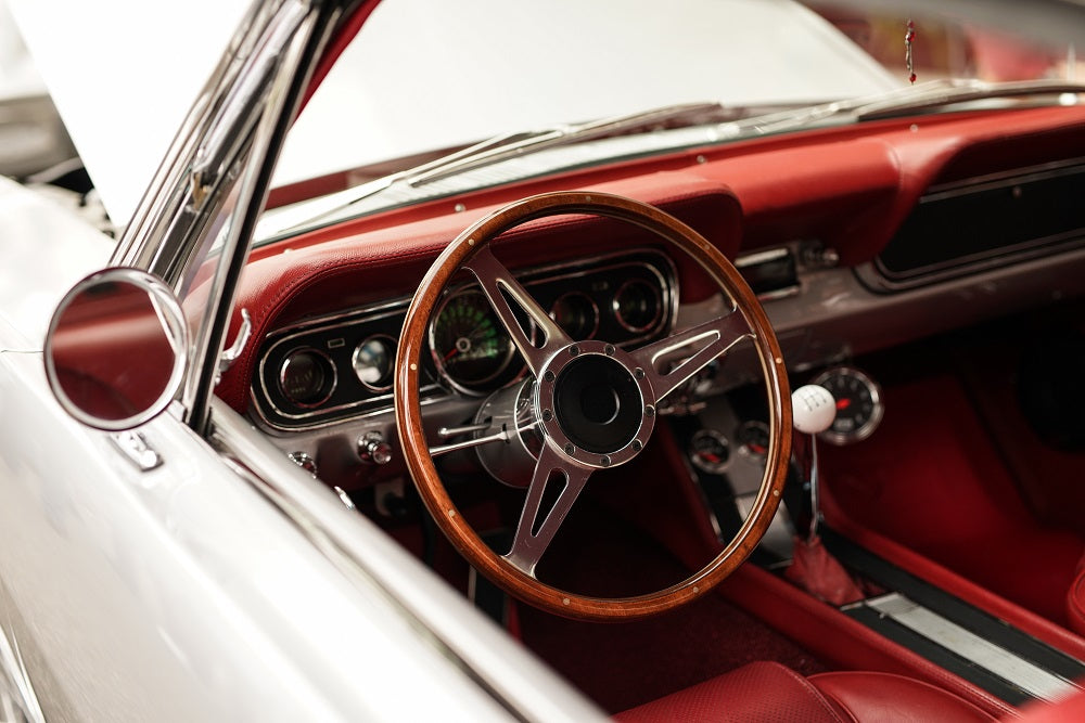 high-angle-closeup-shot-white-retro-car-with-beautiful-steering-wheel